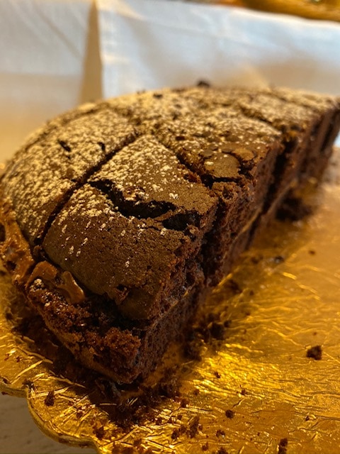 Chocolate cake dessert on gold platter at Hotel Mirasole, Gaeta