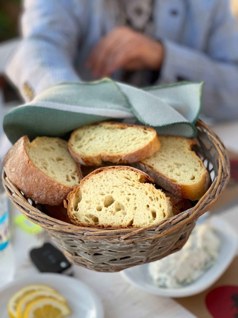 Fresh bread in Santorini with a hint of yellow from corn in a basket